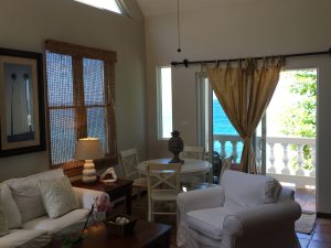 Dining table and balcony at Tres Sirenas Sea View Apartment